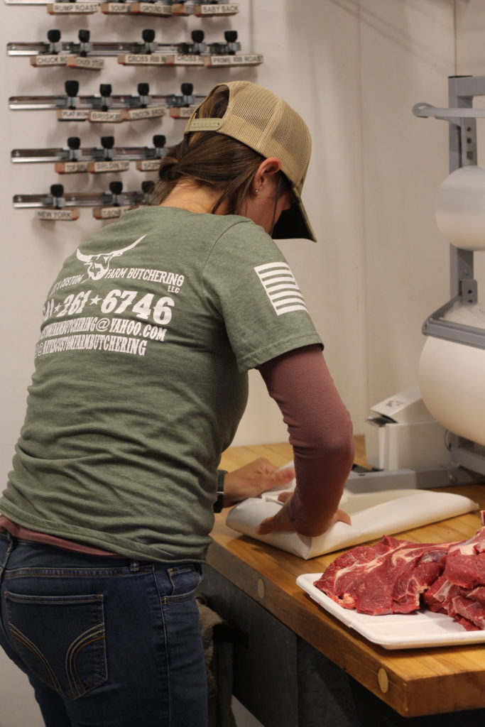 Stefani Petersen wrapping beef for a local grass-fed producer.